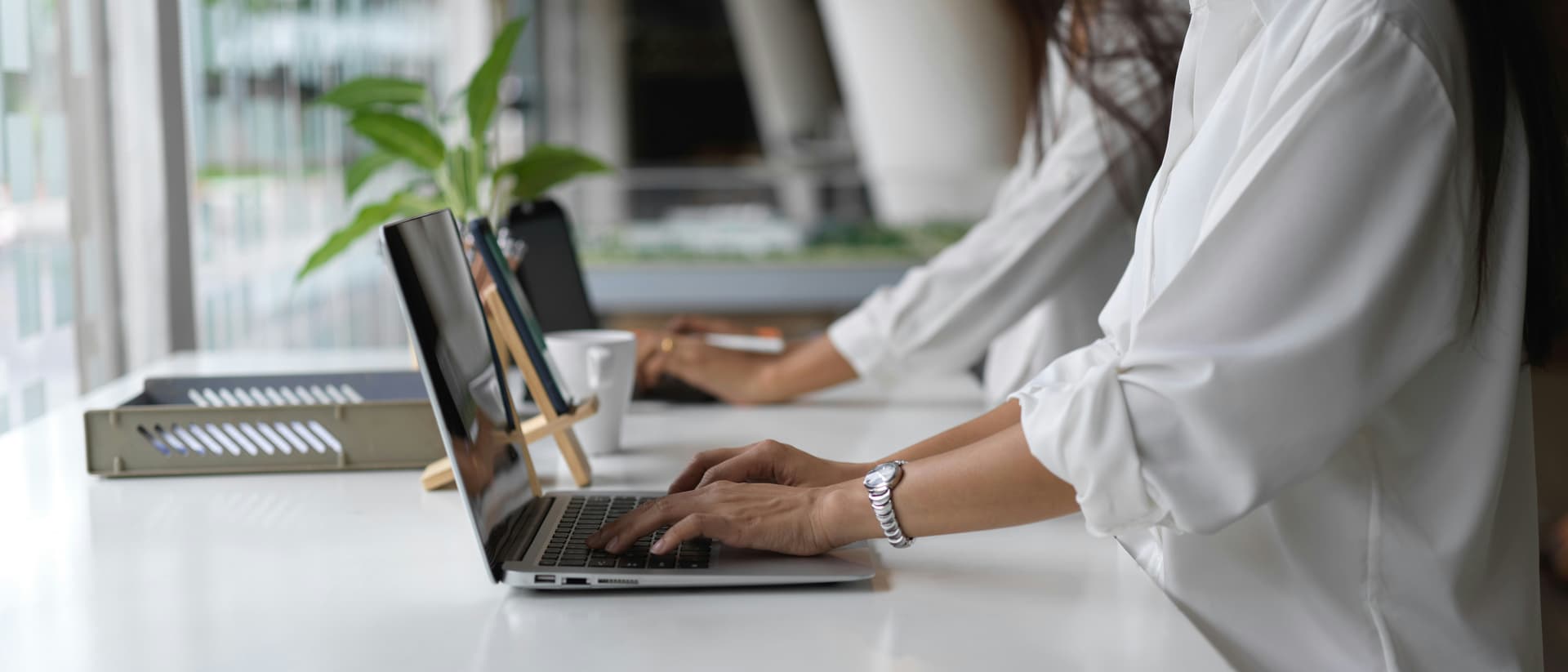 Two people collaborating at a laptop