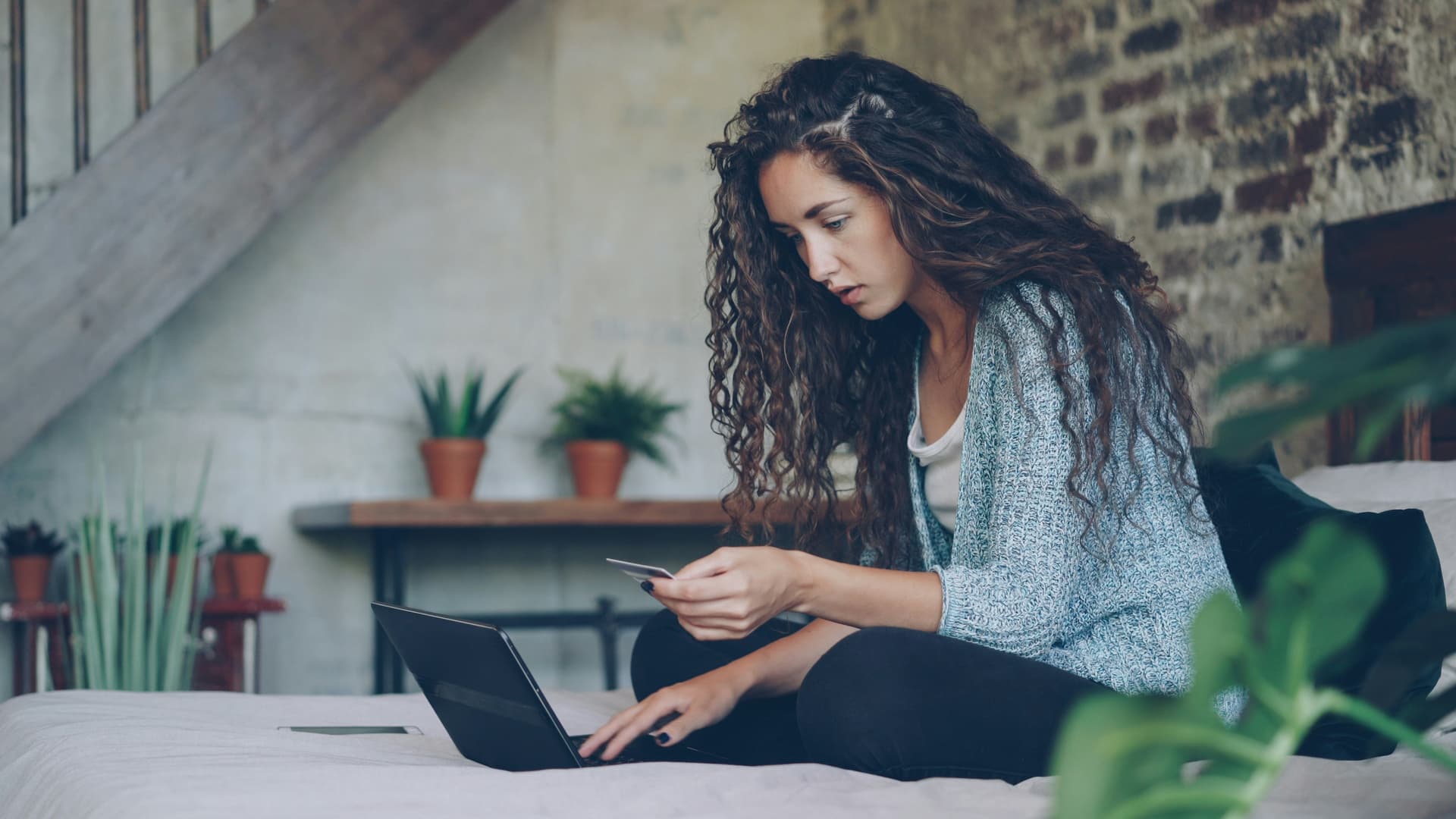 People reviewing secure information on a laptop